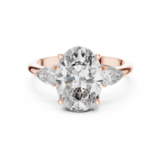 Lab Grown Oval Three Stone Diamond Ring with Pear Side Stones in Yellow Gold
