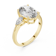 Lab Grown Oval Three Stone Diamond Ring with Pear Side Stones in Yellow Gold