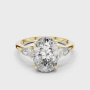 Lab Grown Oval Three Stone Diamond Ring with Pear Side Stones in Yellow Gold