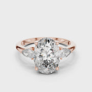 Lab Grown Oval Three Stone Diamond Ring with Pear Side Stones in Yellow Gold