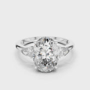 Lab Grown Oval Three Stone Diamond Ring with Pear Side Stones in Yellow Gold